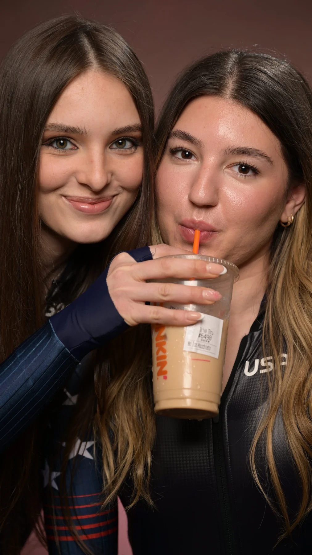 Nastasja holding an iced coffee for Natasa